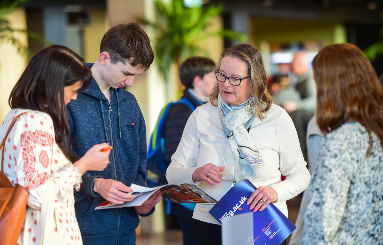 Casually dressed students and parents are attending the open space in the Catalyst at National Apprenticeship Week 2024 event