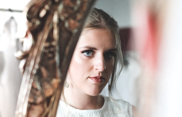 A bride looking in a mirror