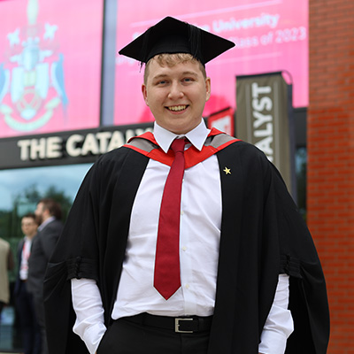 Brandon Briggs in his graduation cap and gown