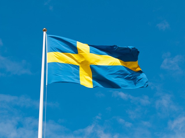 The Swedish flag blowing in the wind