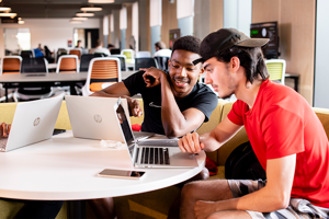 Two students looking at a computer screen