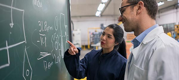 engineering student chatting with teacher