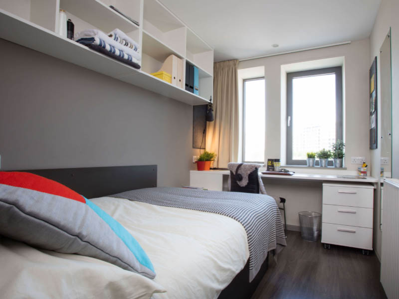 Bedroom at Unite Stratford One including drawers, shelving, desk and bed